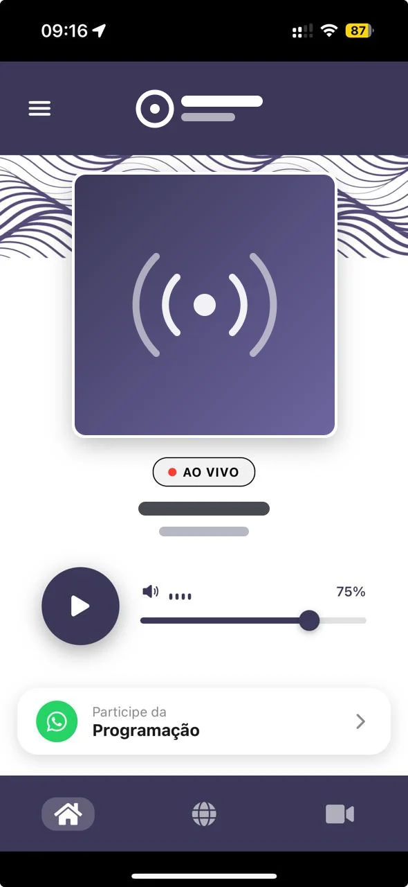 Radio station app, with brand, cover art and banner hidden: live player, volume control and access to listener participation via WhatsApp.